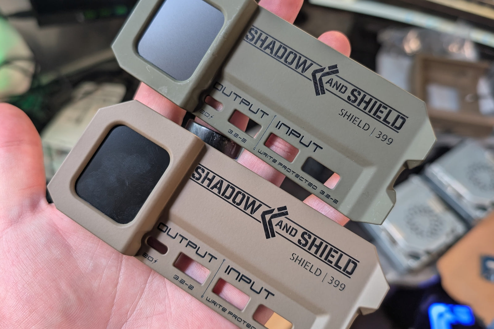 Shield 399 touchscreen and port-panel components in two finish colors