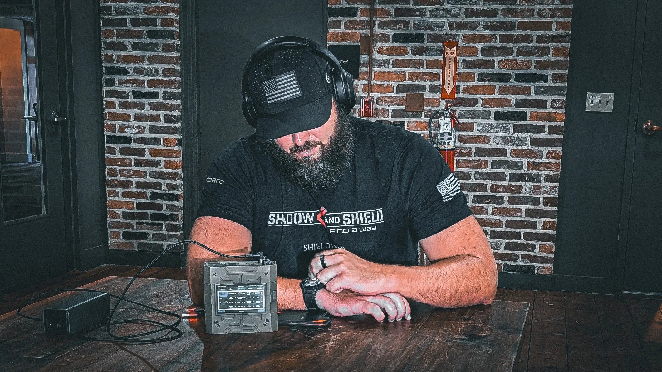 Shadow and Shield founder operating a Shield-399 unit at a work table